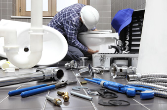 Plumber At Work In A Bathroom, Plumbing Repair Service, Assemble