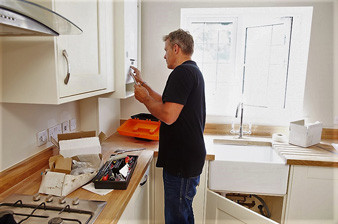 Man working on a new kitchen installation